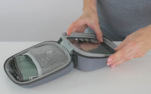 Holding blood pressure monitor case with bpm